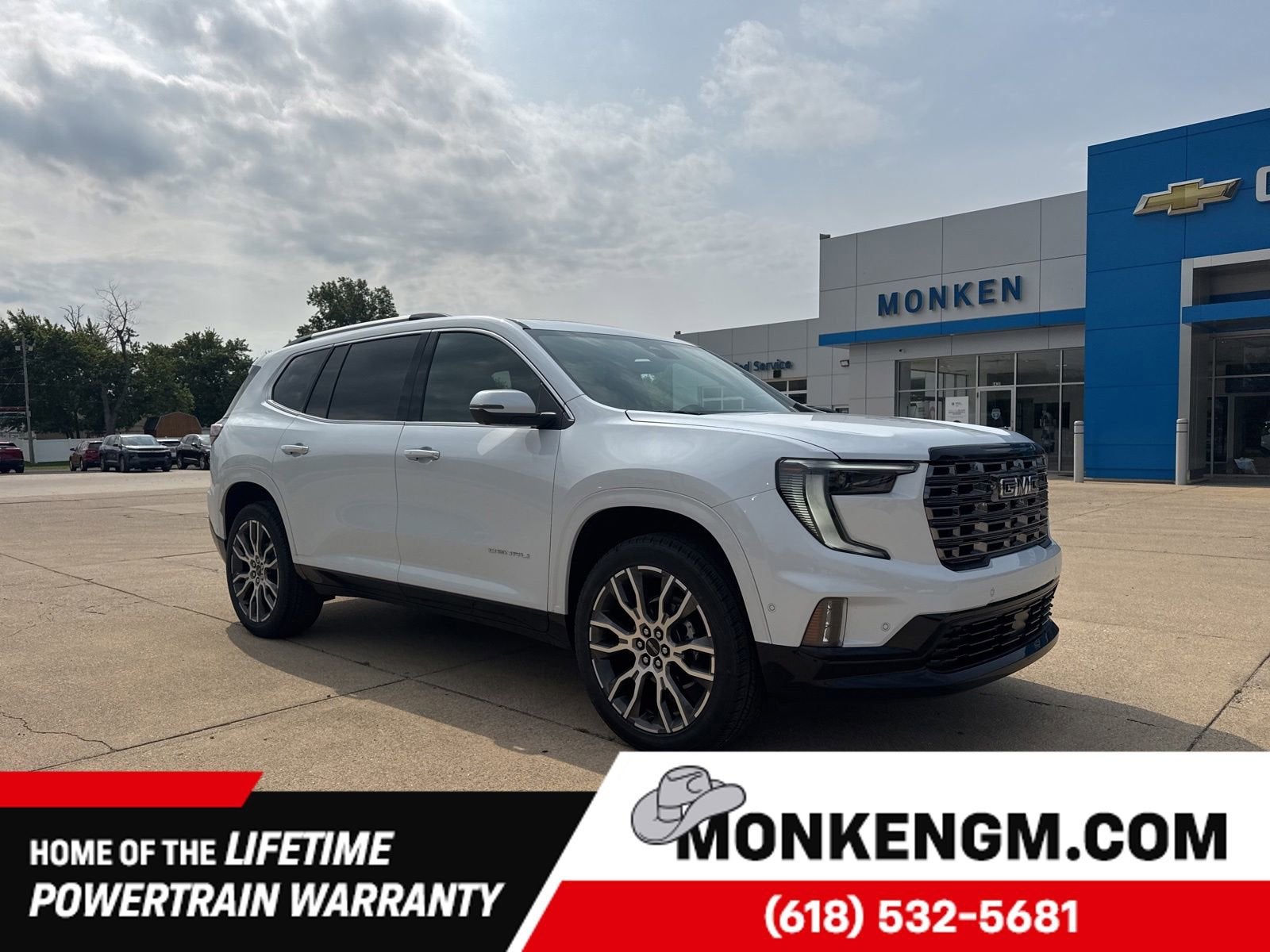 2026 GMC Acadia Denali Ultimate in Glacier White Tricoat — front three-quarter view