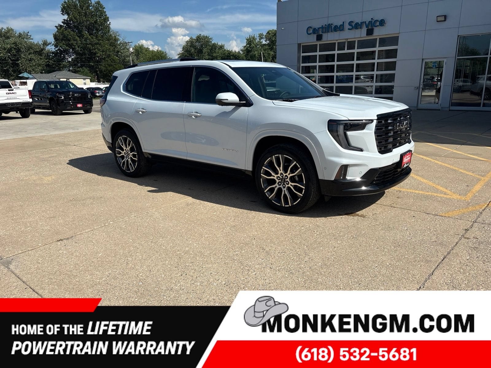 2026 GMC Acadia Denali Ultimate in Glacier White Tricoat — front three-quarter view