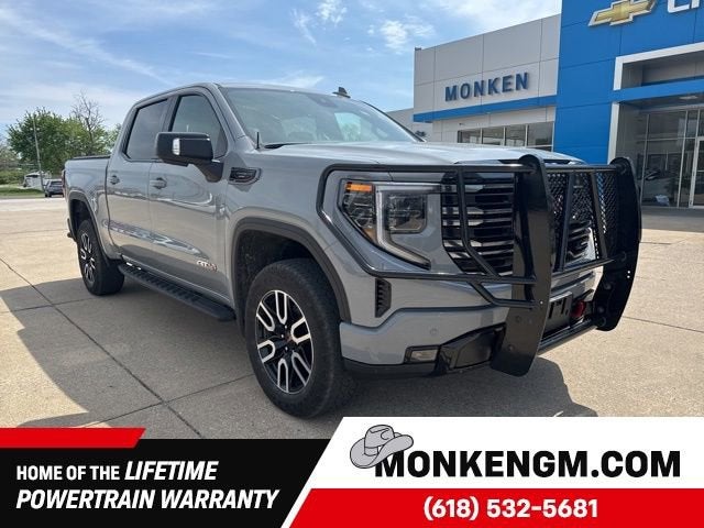 2025 GMC Sierra 1500 AT4 in Thunderstorm Gray — front three-quarter view
