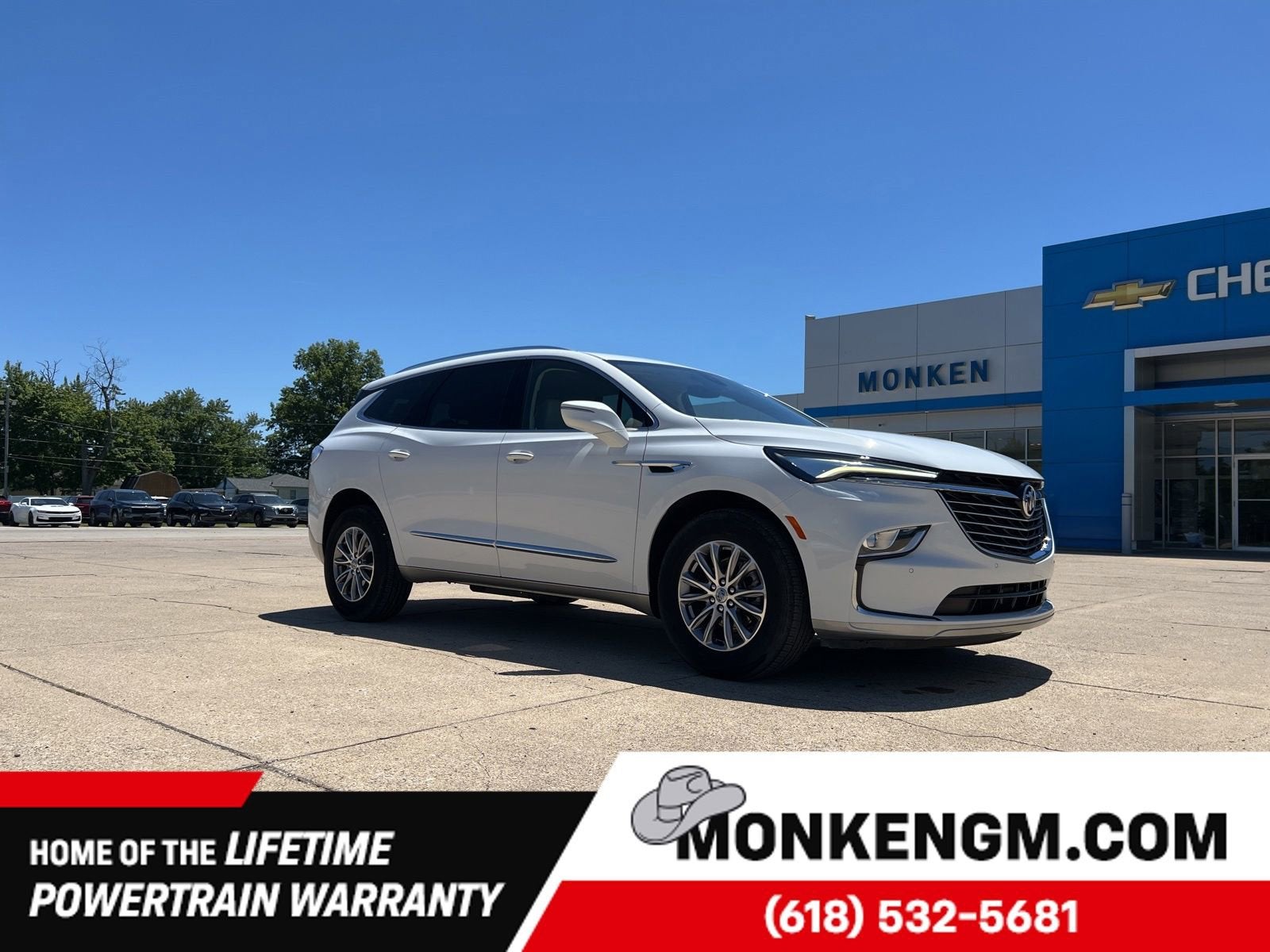 2023 Buick Enclave Essence in Summit White — front three-quarter view