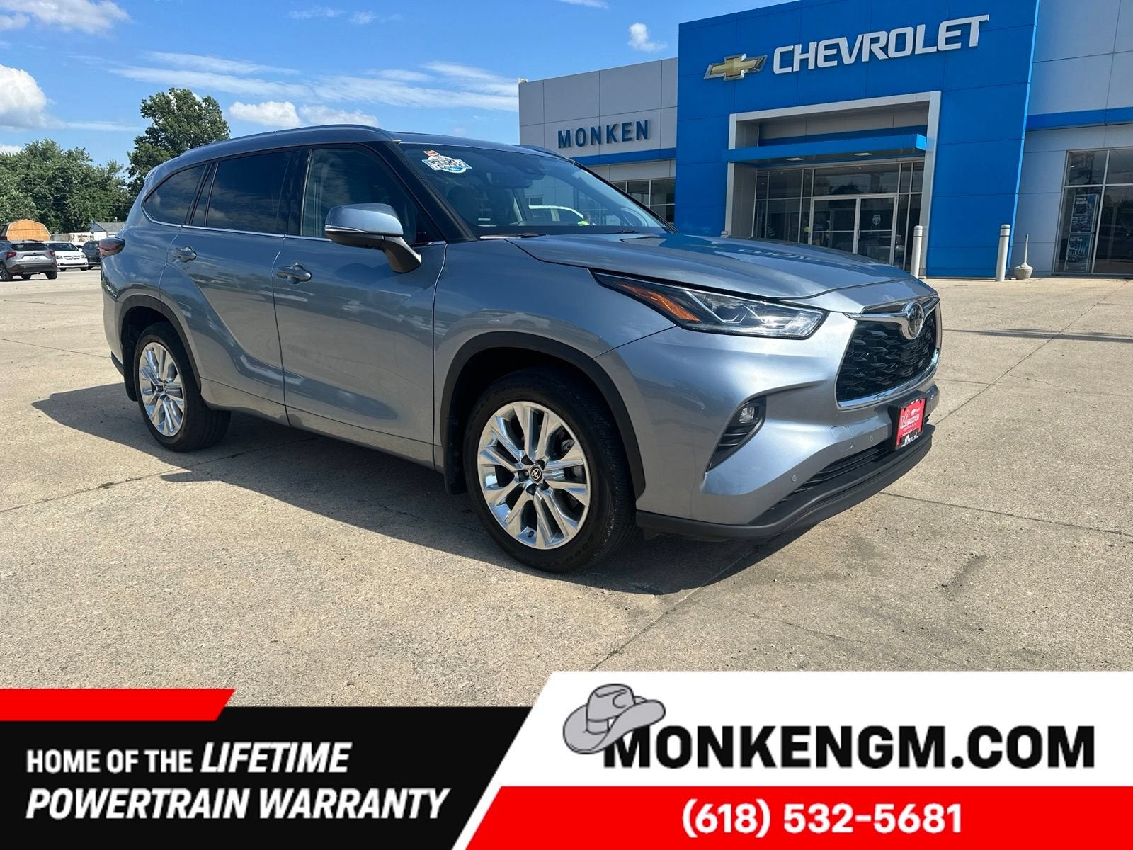 2024 Toyota Highlander LE in Gray — front three-quarter view